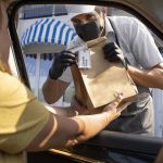 man giving an order for a curbside pickup