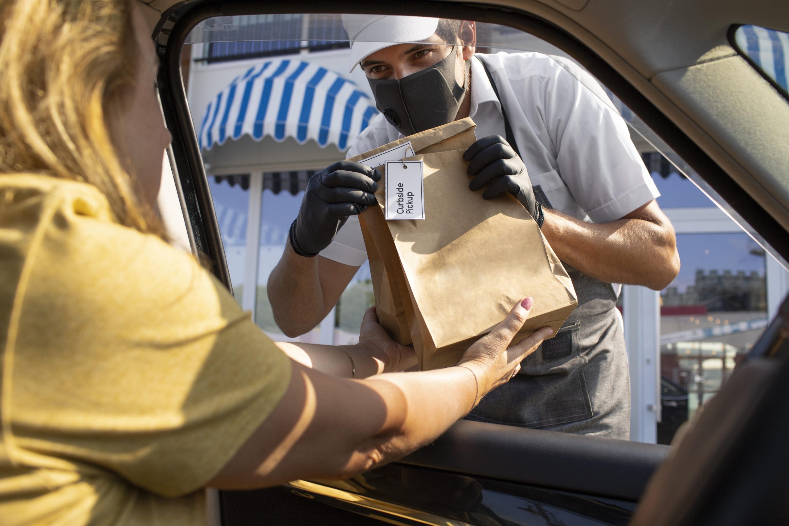 man giving an order for a curbside pickup