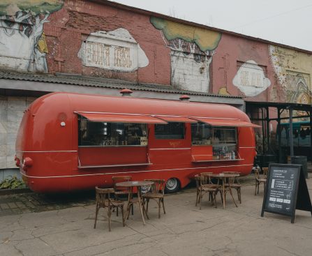 A Red Food Truck on a Brick Pavement