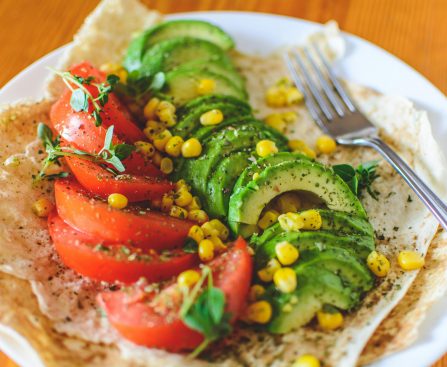 Sliced Tomato and Avocado on White Plate